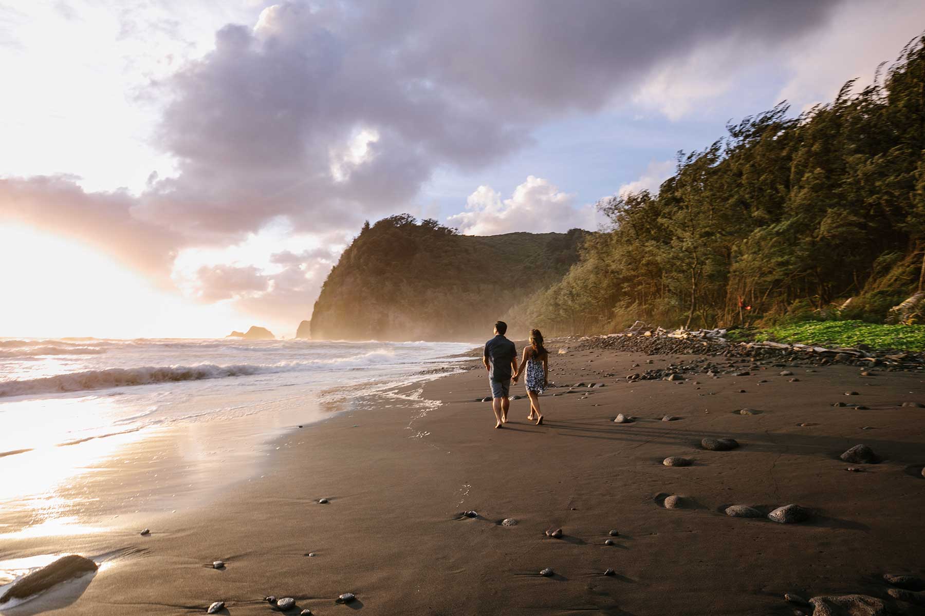 image of couple walking on the beach