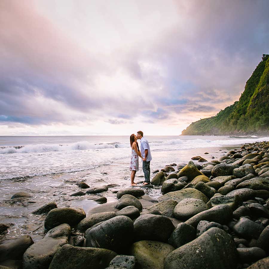 image of couple together at the beach near rocks