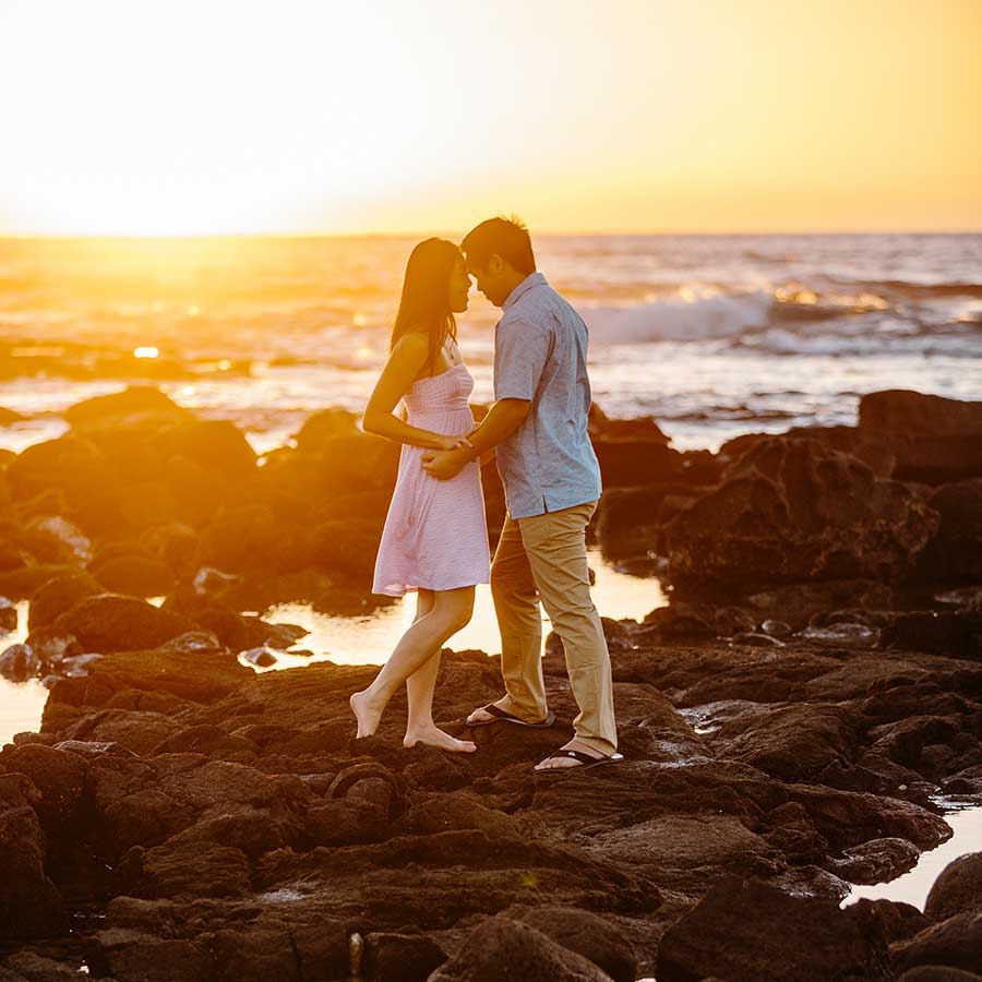 image of couple together on lava rock